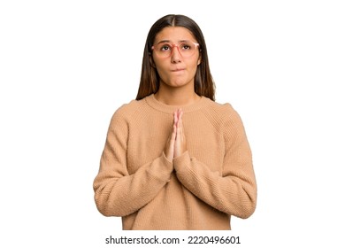 Young Indian Woman Isolated Cutout Removal Background Holding Hands In Pray Near Mouth, Feels Confident.