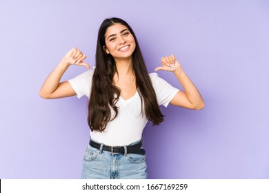 Young indian woman isolated on purple background feels proud and self confident, example to follow. - Shutterstock ID 1667169259