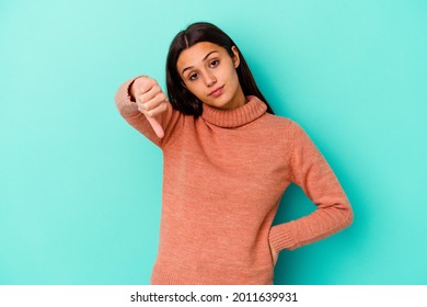 Young Indian woman isolated on blue background showing thumb down, disappointment concept. - Shutterstock ID 2011639931