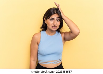 Young Indian Woman Isolated On Yellow Background Being Shocked, She Has Remembered Important Meeting.