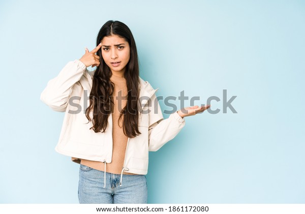 Young Indian Woman On Blue Background Stock Photo 1861172080 | Shutterstock