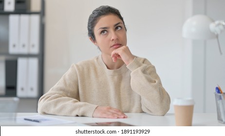 Young Indian Woman Thinking About Something 