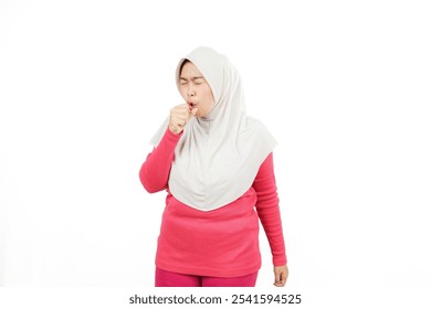 Young Indonesian Muslim woman wearing hijab coughing while exercising, concept of healthy lifestyle by exercising and consuming healthy and nutritious food, isolated on white background.