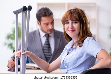 Young Injured Woman And Male Lawyer In The Courtroom