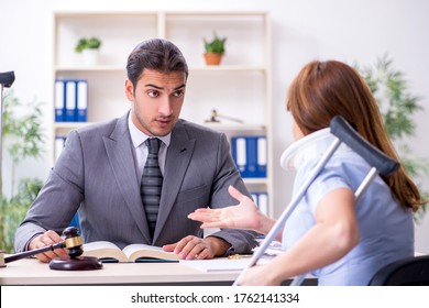 Young Injured Woman And Male Lawyer In The Courtroom