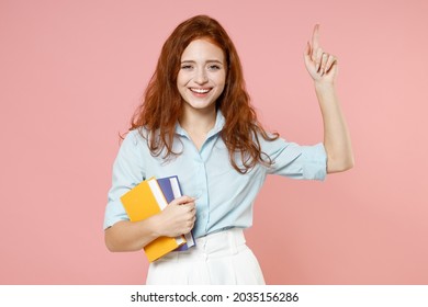 Young Insighted Proactive Redhead Student Woman In Blue Shirt Hold Book Index Finger Up Great New Idea Isolated On Pastel Pink Background Studio Portrait Education School University College Concept