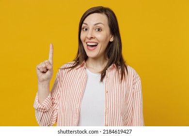 Young Insighted Smart Proactive Woman She 30s Wear Striped Shirt White T-shirt Holding Index Finger Up With Great New Idea Isolated On Plain Yellow Background Studio Portrait. People Lifestyle Concept