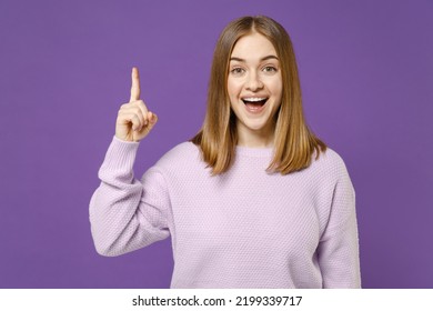 Young Intelligent Smart Proactive Insighted Sad Happy Caucasian Woman 20s Wearing Purple Knitted Sweater Holding Index Finger Up With Great New Idea Isolated On Violet Color Background Studio Portrait