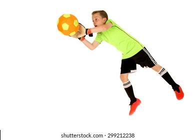 Young Intense Boy Soccer Goalie Blocking Shot 