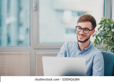 Young Intern Working At The Office