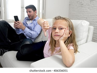 Young Internet Addict Father Using Mobile Phone Ignoring His Little Sad Daughter Looking Bored Lonely And Depressed Feeling Abandoned And Disappointed With Her Dad In Parent Bad Selfish Behavior