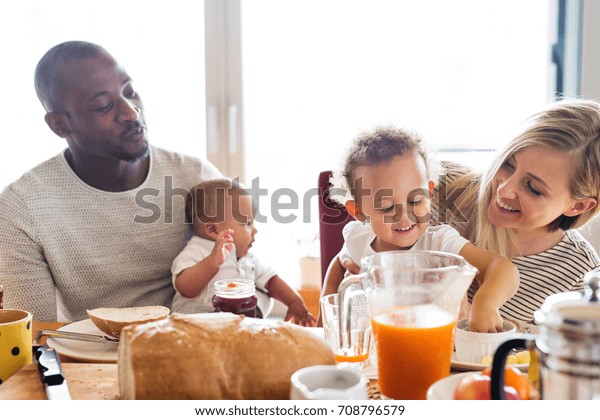 young-interracial-family-little-children-600w-708796579.jpg