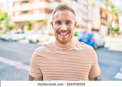 Young Irish Man Smiling Happy Walking At Street Of City.