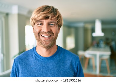 Young Irish Man Smiling Happy Standing At Home