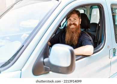 Young Irish Man Smiling Happy Driving Car At The City.