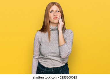 Young Irish Woman Wearing Casual Clothes Touching Mouth With Hand With Painful Expression Because Of Toothache Or Dental Illness On Teeth. Dentist 