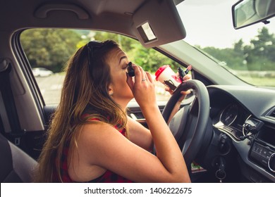 Young Irresponsible Beautiful Woman Is In Her Car And Enjoying Doing Make Up Using Rear View Mirror, Near Miss