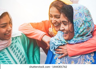 Young Islamic Friends Having Fun Outdoor - Happy Arabian Friends Laughing And Smiling Together - Friendship, Religion, Ethnic Culture And Youth Concept - Focus On Center Girl Face