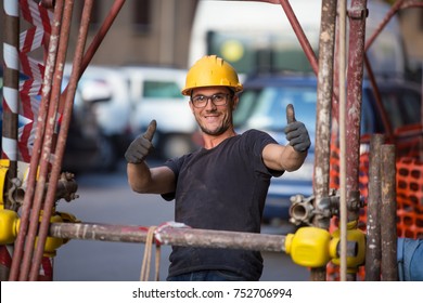 Young Italian Building Worker, Engineer Smiling And Showing Thumb Up. Streets Of Sicily, Reportage, Palermo, November 2016.