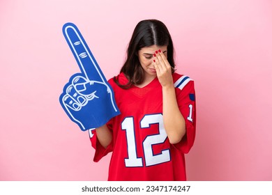 Young Italian fan woman with foam hand isolated on pink background with tired and sick expression - Powered by Shutterstock