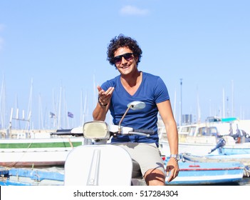 Young Italian Man On Scooter Smiling