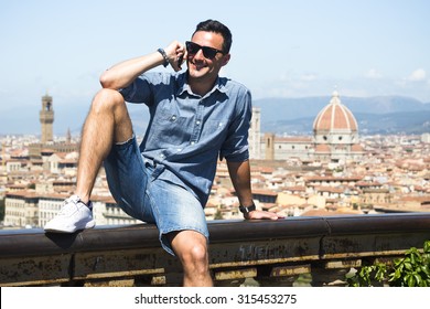 The Young Italian Man Use His Phone In Firenze