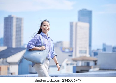 Young Japanese business woman commuting