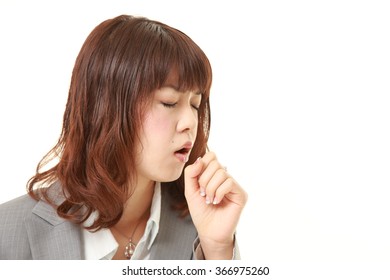 young Japanese businesswoman coughing - Powered by Shutterstock