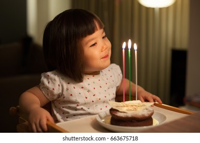 Young Japanese girl celebrating her third birthday.