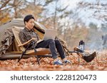 Young Japanese man enjoying solo camping