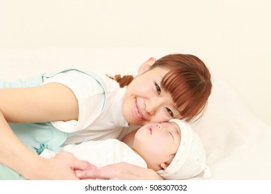 Young Japanese Mom Her Sleeping Baby Stock Photo Edit Now