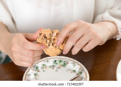 Young Japanese Woman Eating Scone