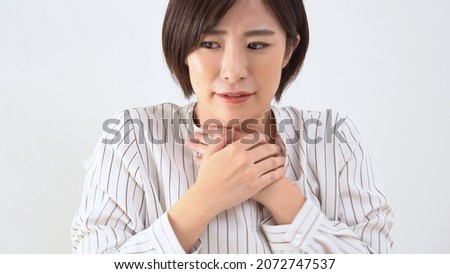 Young Japanese woman suffering from cold