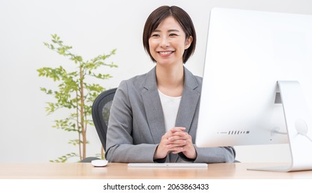 Young Japanese Woman In A Suit
