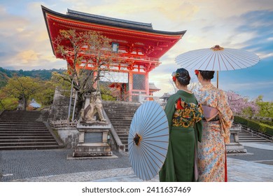Young Japanese woman in a traditional Kimono dress at Kiyomizu-dera temple in Kyoto, Japan
