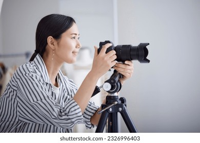 Young Japanese woman working as a photographer