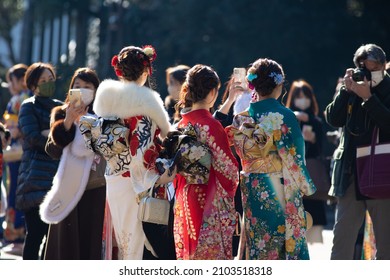 Young Japanese women wearing traditional kimonos for their coming of age day at the Meiji Jingu shrine in Tokyo, Japan.