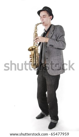 The young jazz man plays a saxophone