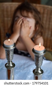 Young Jewish Girl Says The Blessing Upon Lighting The Sabbath Candles Before Shabbat Jewish Holiday Eve Dinner.