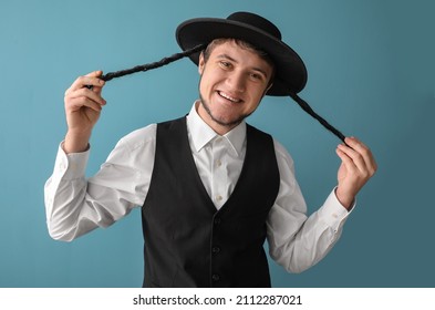 Young Jewish Man In Traditional Costume On Grey Background