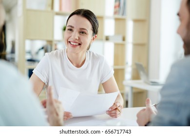 Young Job Seeker With Resume Talking To Employers