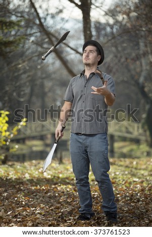 Similar – Image, Stock Photo bearded man huntsman with two axes stands near a rusty train