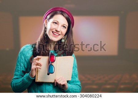 Young joyful brunette girl with 3d glasses and book.