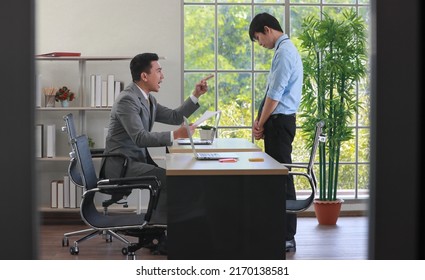 A Young Junior Employee Feels Guilt And Sad When The Boss Blame And Abuses Him For His Wrong Work. Problem And Stress In Daily Office Work Concept.