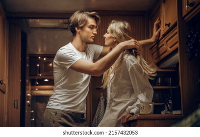 Young Just Married Couple,lovers Traveling In Camper,house On Wheels,trailer,motor Home.Love Romantic Road Travel,freedom Life. Small Kitchen,cooking In Van.Wanderlust Vacation,weekend. Girl,guy,happy