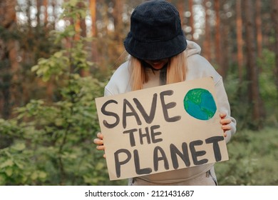 Young Kid Child Holding In Hands Green Posters At No War In World. Youth Protesting For Safe Ecology,global Warming And Pollution, Plastic In Public Demonstration. Climate Strike. Eco Activism