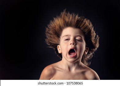 Young Kid With Crazy Expression And Flying Hair