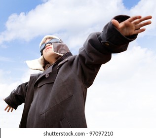 Young Kid Dreaming Of Being A Pilot Looking At The Sky