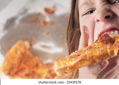 Young Kid Eating Fast Food Pizza