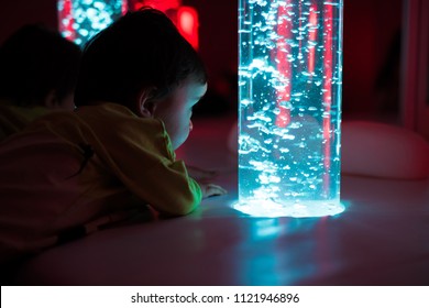 Young Kid Exploring A Multi Sensory Space - Snoezelen Concept